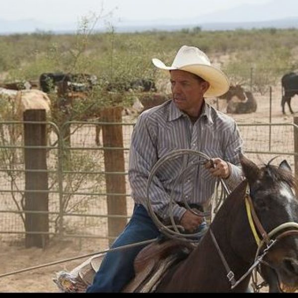 "Owner of Cocoraque Ranch riding a horse - embodying the ranch's spirit and heritage."